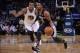 November 20, 2013; Oakland, CA, USA; Memphis Grizzlies point guard Mike Conley (11) dribbles the ball against Golden State Warriors small forward Andre Iguodala (9) during the first quarter at Oracle Arena. Mandatory Credit: Kyle Terada-USA TODAY Sports