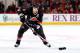 RALEIGH, NC - MARCH 26: Tim Gleason #6 of the Carolina Hurricanes looks to pass the puck against the Winnipeg Jets during their NHL game at PNC Arena on March 26, 2013 in Raleigh, North Carolina. (Photo by Gregg Forwerck/NHLI via Getty Images)