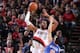 PORTLAND, OR - NOVEMBER 25: LaMarcus Aldridge #12 of the Portland Trail Blazers passes the ball against Pablo Prigioni #9 of the New York Knicks on November 25, 2013 at the Moda Center Arena in Portland, Oregon. NOTE TO USER: User expressly acknowledges a