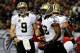 ATLANTA, GA - NOVEMBER 21: Tight end Benjamin Watson #82 celebrates a touchdown with quarterback Drew Brees #9 of the New Orleans Saints in the first quarter against the Atlanta Falcons during a game at the Georgia Dome on November 21, 2013 in Atlanta, Ge