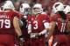 GLENDALE, AZ - NOVEMBER 24: Quarterback Carson Palmer #3 of the Arizona Cardinals talks with his team in the huddle during the NFL game against the Indianapolis Colts at the University of Phoenix Stadium on November 24, 2013 in Glendale, Arizona. The Car
