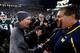 EAST LANSING, MI - NOVEMBER 02: Head coach Mark Dantonio of the Michigan State Spartans shakes hands with head coach Brady Hoke of the Michigan Wolverines following his team's 29-6 victory at Spartan Stadium on November 2, 2013 in East Lansing, Michigan.