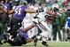 Nov 24, 2013; Baltimore, MD, USA; New York Jets running back Bilal Powell (29) runs with the ball as Baltimore Ravens linebacker Daryl Smith (51) and linebacker Pernell McPhee (90) tackle at M&T Bank Stadium. The Ravens won 19-3. Mandatory Credit: Evan Ha