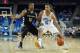 LOS ANGELES, CA - NOVEMBER 12: Kyle Anderson #5 of the UCLA Bruins drives to the basket past Duke Mondy #10 of the Oakland Golden Grizzlies in the first half at Pauley Pavilion on November 12, 2013 in Los Angeles, California. (Photo by Jeff Gross/Getty