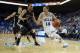 LOS ANGELES, CA - NOVEMBER 12: Zach LaVine #14 of the UCLA Bruins drives to the basket past Tommie McCune #23 of the Oakland Golden Grizzlies in the first half at Pauley Pavilion on November 12, 2013 in Los Angeles, California. (Photo by Jeff Gross/Gett