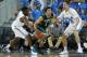 LOS ANGELES, CA - NOVEMBER 18: Cody Demps #2 of the Sacramento State Hornets is defended by Jordan Adams (L) and David Wear #12 of the UCLA Bruins in the second half at Pauley Pavilion on November 18, 2013 in Los Angeles, California. UCLA defeated Sacram