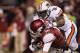 FAYETTEVILLE, AR - NOVEMBER 2: Brandon Allen #10 of the Arkansas Razorbacks is sacked by Dee Ford #30 of the Auburn Tigers at Razorback Stadium on November 2, 2013 in Fayetteville, Arkansas. The Tigers defeated the Razorbacks 35-17. (Photo by Wesley Hi
