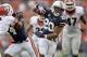 Nov 16, 2013; Auburn, AL, USA; Auburn Tigers running back Corey Grant (20) avoids Georgia Bulldogs defenders and scores a touchdown during the first half at Jordan Hare Stadium. Mandatory Credit: John Reed-USA TODAY Sports