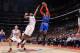 LOS ANGELES, CA - NOVEMBER 27: Carmelo Anthony #7 of the New York Knicks shoots against Reggie Bullock #25 of the Los Angeles Clippers at Staples Center on November 27, 2013 in Los Angeles, California. NOTE TO USER: User expressly acknowledges and agrees