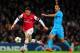LONDON, ENGLAND - NOVEMBER 26: Mesut Oezil of Arsenal breaks away from Jeremy Morel of Marseille during the UEFA Champions League Group F match between Arsenal and Olympique de Marseille at Emirates Stadium on November 26, 2013 in London, England. (Phot