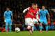 LONDON, ENGLAND - NOVEMBER 26: Mesut Oezil of Arsenal shoots and misses from the penalty spot during the UEFA Champions League Group F match between Arsenal and Olympique de Marseille at Emirates Stadium on November 26, 2013 in London, England. (Photo b