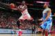 CHICAGO, IL - OCTOBER 25: Luol Deng #9 of the Chicago Bulls against goes up for the layup against the Denver Nuggets on October 25, 2013 at the United Center in Chicago, Illinois. NOTE TO USER: User expressly acknowledges and agrees that, by downloading