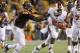 TEMPE, AZ - NOVEMBER 16: Running back Terron Ward #28 of the Oregon State Beavers stiff arms defensive back Damarious Randall #3 of the Arizona State Sun Devils during the third quarter of their college football game at Sun Devil Stadium on November 16,