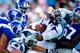 CHARLOTTE, NC - SEPTEMBER 22: Cam Newton #1 of the Carolina Panthers drives Jacquian Williams #57 of the New York Giants across the goal line for a touchdown during play at Bank of America Stadium on September 22, 2013 in Charlotte, North Carolina. The P