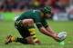 WREXHAM, WALES - NOVEMBER 16: Johnathan Thurston of Australia lines up a kick during the Rugby League World Cup Quarter Final match between Australia and USA at Racecourse Ground on November 16, 2013 in Wrexham, Wales. (Photo by Alex Livesey/Getty Image
