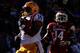 BATON ROUGE, LA - NOVEMBER 29: Terrence Magee #14 of the LSU Tigers scores a touchdown past Eric Bennett #14 of the Arkansas Razorbacks at Tiger Stadium on November 29, 2013 in Baton Rouge, Louisiana. (Photo by Chris Graythen/Getty Images)