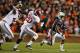 AUBURN, AL - NOVEMBER 30: Tre Mason #21 of the Auburn Tigers runs the ball in the second quarter against Jarrick Williams #20 of the Alabama Crimson Tide at Jordan-Hare Stadium on November 30, 2013 in Auburn, Alabama. (Photo by Kevin C. Cox/Getty Images