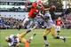 Nov 30, 2013; Atlanta, GA, USA; Georgia Bulldogs running back Todd Gurley (3) dives into the end zone for a touchdown over Georgia Tech Yellow Jackets cornerback D.J. White (28) and linebacker Brandon Watts (11) in the first half at Bobby Dodd Stadium. Ma