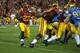 LOS ANGELES, CA - NOVEMBER 30: Running back Tre Madden #23 of the USC Trojans carries the ball against the UCLA Bruins at Los Angeles Coliseum on November 30, 2013 in Los Angeles, California. (Photo by Stephen Dunn/Getty Images)