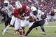 STANFORD, CA - SEPTEMBER 21: Running back Marion Grice #1 of the Arizona State Sun Devils rushes up the field as defensive end Ben Gardner #49 of the Stanford Cardinal pressures during the second quarter of their game at Stanford Stadium on September 21,