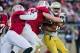 Nov 30, 2013; Stanford, CA, USA; Notre Dame Fighting Irish running back Tarean Folston (25) is tackled by Stanford Cardinal linebacker Kevin Anderson (48) and defensive end Henry Anderson (91) in the first quarter at Stanford Stadium. Mandatory Credit: Ma