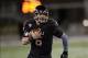 Nov 26, 2013; DeKalb, IL, USA; Northern Illinois Huskies quarterback Jordan Lynch (6) rushes the ball against the Western Michigan Broncos during the first quarter at Huskie Stadium. Mandatory Credit: Mike DiNovo-USA TODAY Sports