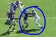 Pugh's left arm is outside of the defender.