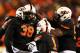 STILLWATER, OK - NOVEMBER 23: Emmanuel Ogbah #38 of the Oklahoma State Cowboys celebrates with teammates in the second quarter against the Baylor Bears at Boone Pickens Stadium on November 23, 2013 in Stillwater, Oklahoma. (Photo by Ronald Martinez/Gett