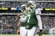 Dec 1, 2013; East Rutherford, NJ, USA; New York Jets quarterback Geno Smith (7) and wide receiver David Nelson (86) walk off the field after an incomplete third down pass against the Miami Dolphins during the second quarter of a game at MetLife Stadium. M