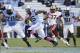 Oct 26, 2013; Chapel Hill, NC, USA; North Carolina Tar Heels tight end Eric Ebron (85) drives past Boston College Eagles defensive back Bryce Jones (17) during the second half at Kenan Memorial Stadium. North Carolina won 34-10. Mandatory Credit: Liz Cond