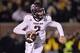 Nov 30, 2013; Columbia, MO, USA; Texas A&M Aggies quarterback Johnny Manziel (2) rolls to the outside against the Missouri Tigers during the second half at Faurot Field. Missouri defeated Texas A&M 28-21. Mandatory Credit: Peter G. Aiken-USA TODAY Sports