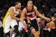 December 1, 2013; Los Angeles, CA, USA; Portland Trail Blazers small forward Nicolas Batum (88) moves the ball against the defense of Los Angeles Lakers small forward Xavier Henry (7) during the first half at Staples Center. Mandatory Credit: Gary A. Vasq