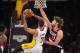 December 1, 2013; Los Angeles, CA, USA; Portland Trail Blazers center Robin Lopez (42) defends against Los Angeles Lakers small forward Xavier Henry (7) during the first half at Staples Center. Mandatory Credit: Gary A. Vasquez-USA TODAY Sports