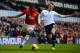 LONDON, ENGLAND - DECEMBER 01: Luis Antonio Valencia of Manchester United and Vlad Chiriches of Tottenham Hotspur battle for the ball during the Barclays Premier League Match between Tottenham Hotspur and Manchester United at White Hart Lane on December
