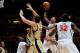 Nov 28, 2012; Champaign, IL, USA; Illinois Fighting Illini guard Joseph Bertrand (2) makes a basket over Georgia Tech Yellow Jackets center Daniel Miller (5) and Georgia Tech Yellow Jackets forward Kammeon Holsey (24) during the second half at Assembly Ha