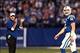 Dec 1, 2013; Indianapolis, IN, USA; Indianapolis Colts coach Chuck Pagano claps in the background as quarterback Andrew Luck (12) walks off the field during a game against the Tennessee Titans at Lucas Oil Stadium. Mandatory Credit: Brian Spurlock-USA TOD