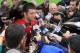 FOXBORO, MA - JULY 26: Tim Tebow #5 interacts with the media after the first day of New England Patriots Training Camp at Gillette Stadium on July 26, 2013 in Foxboro, Massachusetts. (Photo by Jim Rogash/Getty Images)