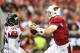 GLENDALE, AZ - OCTOBER 27: Quarterback Carson Palmer #3 of the Arizona Cardinals scrambles with the football pressured by defensive tackle Jonathan Babineaux #95 of the Atlanta Falcons during the NFL game at the University of Phoenix Stadium on October 2