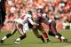 SAN FRANCISCO - NOVEMBER 21: Vernon Davis #85 of the San Francisco 49ers is tackled by Geno Hayes #54 and Cody Grimm #35 of the Tampa Bay Buccaneers at Candlestick Park on November 21, 2010 in San Francisco, California. (Photo by Ezra Shaw/Getty Images)