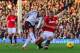 LONDON, ENGLAND - NOVEMBER 02: Nemanja Vidic of Manchester United tackles Dimitar Berbatov of Fulham during the Barclays Premier League match between Fulham and Manchester United at Craven Cottage on November 2, 2013 in London, England. (Photo by Clive