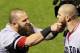ST LOUIS, MO - OCTOBER 27: Mike Napoli #12 of the Boston Red Sox pulls teammate Jonny Gomes #5 beard after hitting a three run home run to left field against Seth Maness #61 of the St. Louis Cardinals in the sixth inning during Game Four of the 2013 Worl
