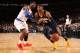 NEW YORK, NY - NOVEMBER 20: Paul George #24 of the Indiana Pacers drives against Iman Shumpert #21 of the New York Knicks during a game at Madison Square Garden in New York City on November 20, 2013. NOTE TO USER: User expressly acknowledges and agrees t