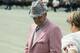 Coach Bear Bryant of the Alabama Crimson Tide watches his players during a game.