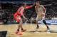 SAN ANTONIO, TX - November 30: Tim Duncan #21 of the San Antonio Spurs controls the ball against Dwight Howard #12 of the Houston Rockets at the AT&T Center on November 30, 2013 in San Antonio, Texas. NOTE TO USER: User expressly acknowledges and agrees t