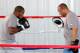 Lara (left) puts in work with trainer Ronnie Shields.