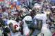 Nov 30, 2013; Gainesville, FL, USA; Florida State Seminoles wide receiver Kelvin Benjamin (1) is congratulated by wide receiver Rashad Greene (80), offensive linesman Bobby Hart (51) and teammates after he scored a touchdown against the Florida Gators dur