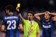NAPLES, ITALY - MAY 05: Referee Danilo Giannoccaro shows the yellow card to Andrea Ranocchia of Inter during the Serie A match between SSC Napoli and FC Internazionale Milano at Stadio San Paolo on May 5, 2013 in Naples, Italy. (Photo by Giuseppe Bellin