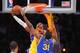 Kobe Bryant attacks the basket.