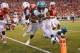 LINCOLN, NE - NOVEMBER 16: Running back Jeremy Langford #33 of the Michigan State Spartans scores after taking a hit from safety Corey Cooper #6 of the Nebraska Cornhuskers during their game at Memorial Stadium on November 16, 2013 in Lincoln, Nebraska. (