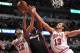 Dec 5, 2013; Chicago, IL, USA; Miami Heat center Chris Bosh (1) is defended by Chicago Bulls shooting guard Kirk Hinrich (12) and center Joakim Noah (13) during the second half at the United Center. The Bulls beat the Heat 107-87. Mandatory Credit: Rob Gr